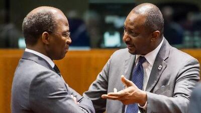 Mali's foreign affairs Minister Tieman Coulibaly, right, talks with Burkina Faso's foreign minister Djibril Bassole before a ministerial meeting on the situation in his country.