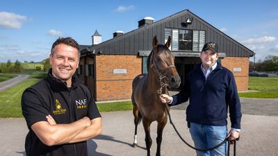 Former England, Liverpool and Manchester United striker Michael Own and trainer Hugo Palmer with racehorse Mr McCann at Manor House Stables, Malpas, Cheshire. Darren Robinson for The National
