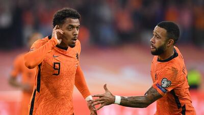 Netherlands forward Donyell Malen, left, celebrates with Memphis Depay after scoring a goal during the World Cup Qatar 2022 qualifying Group G match against Turkey at the Johan Cruijff Arena in Amsterdam. AFP