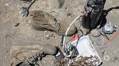 Used boots and other items at a junkyard near the Bagram Air Base. AFP