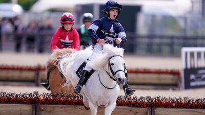 The Royal Windsor Horse Show got under way at Windsor Castle on Thursday, with competitors taking part in the Shetland Pony Grand National. PA