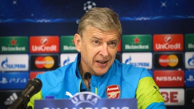 Arsene Wenger addresses reporters at a press conference before Arsenal's Champions League match with Anderlecht in Brussels on Wednesday. Virginie Lefour / AFP / Belga Photo / October 21, 2014