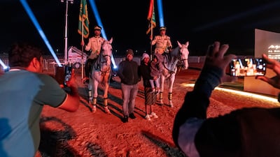 Police on horseback greet visitors at the entrance to the venue