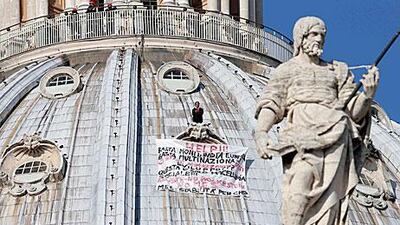 Italian businessman Marcello di Finizio protests on the dome of St Peter's Basilica to protest Italian government and European Union policies.