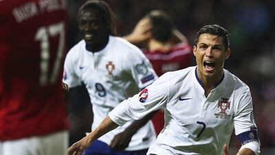 Portugal's Cristiano Ronaldo reacts ater scoring the winning goal against Denmark on Tuesday night in their Euro 2016 qualifying match in Copenhagen. Mario Cruz / EPA / October 14, 2014