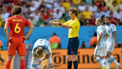 Angel di Maria, down, of Argentina reacts during his team's match against Belgium on Saturday at the 2014 World Cup in Brasilia, Brazil. Peter Powell / EPA