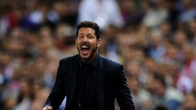 Atletico Madrid manager Diego Simeone shouts instructions to his players. Denis Doyle / Getty Images
