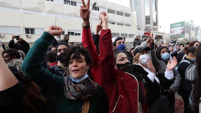 Tunisian anti-government protesters shout slogans during a demonstration in Tunis on Saturday. EPA