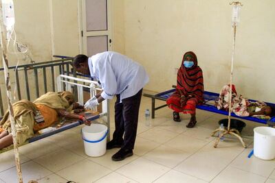 Patients with cholera receive treatment in Wad Al Hilu, Sudan. AFP