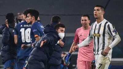 Cristiano Ronaldo watches as Porto's players celebrate at the end of the match. AFP