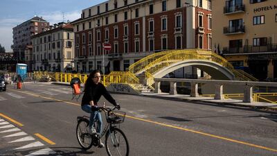 A cyclist rides past the building site of VenTo, a 679km cycle path linking Venice to Turin and other major cities of Northern Italy. Getty Images