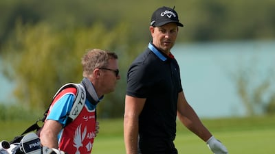 Henrik Stenson of Sweden talks to his caddie on the 18th hole during the first round of Abu Dhabi HSBC Golf Championship on Thursday, January 19, 2023. AP