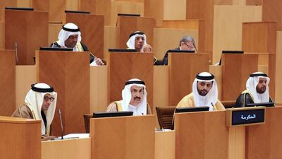 Minister of Labour Saqr Ghobash, second left, says a bill to replace the current legislation is under consideration. Wam