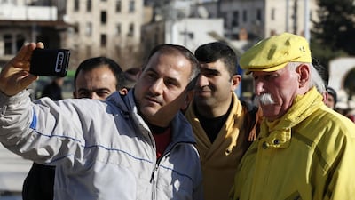 Zakkour poses for a selfie in Saadallah al-Jabiri square