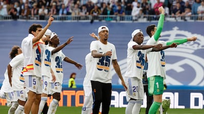 Real Madrid's Thibaut Courtois, Vinicius Junior, Jesus Vallejo, Karim Benzema, Eduardo Camavinga and teammates celebrate. Reuters