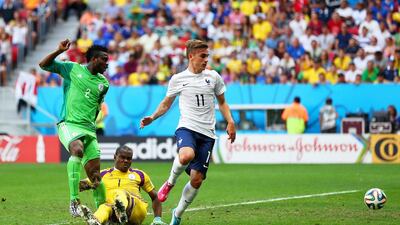 Joseph Yobo of Nigeria, left, scores an own goal as goalkeeper Vincent Enyeama and Antoine Griezmann of France look on during their match on Monday at the 2014 World Cup. Jeff Gross / Getty Images