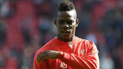 After a tough season at Liverpool, Mario Balotelli has returned to AC Milan on loan. Paul Ellis / AFP