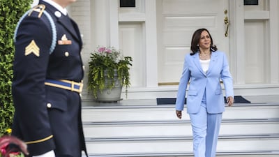 US Vice President Kamala Harris arrives to greet King Abdullah II of Jordan at the vice president's residence in Washington.