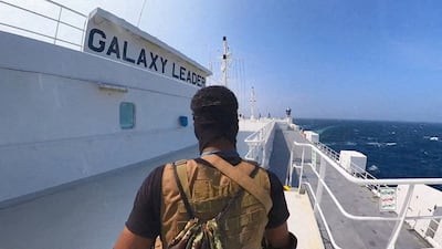 A Houthi fighter stands on the Galaxy Leader cargo ship, which was seized by the Yemeni rebels in the Red Sea. Reuters