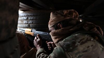 A fighter in the Turkish-backed Syrian National Army mans a post in rebel-held northern Aleppo province. AFP