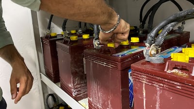 Elias Daou, operation manager at Mectric Engineers, checks batteries linked to solar panels, in the Lebanese town of Sehayleh, 25 kilometres north of Beirut. Reuters