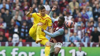 Liverpool's Dejan Lovren battles with Aston Villa's Charles N'Zogbia for the ball during their FA Cup semi-final contest on Sunday at Wembley. Stefan Wermuth / Reuters
