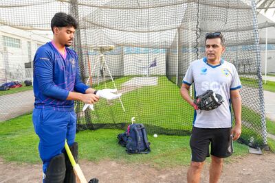 Former UAE captain Khurram Khan with his son Rayan Khan. Pawan Singh for The National