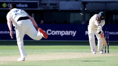 Australia’s Travis Head is clean bowled by Harshit Rana for 11. AFP