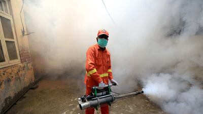 A Pakistani worker sprays an area to prevent dengue fever in Peshawar, Pakistan. Colder countries such as Greece are starting to see a spike in mosquitos and disease. EPA