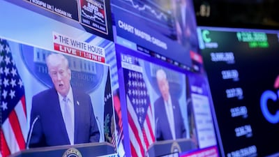 US President Donald Trump is seen on screens on the floor of the New York Stock Exchange. Bloomberg