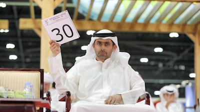 Hamad Salem - the biggest spender at the auction on Friday - bids for camels. Mr Salem spent Dh900,000 on three camels. Pawan Singh / The National