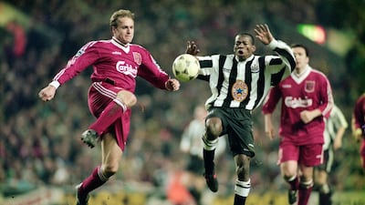 Liverpool defender John Scales, left, challenges Newcastle forward Faustino Asprilla during the famous '4-3' Premier League match at Anfield on April 3, 1996. Getty Images