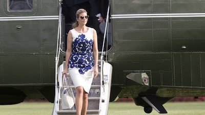 Ivanka Trump, wearing a white shift dress with a blue lace pattern, walks on the White House grounds in Washington on August 30, 2017. EPA
