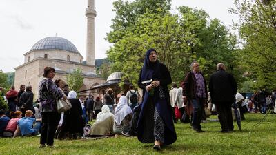 Believers wait for an opening ceremony of the renewed Aladza Mosque. Reuters