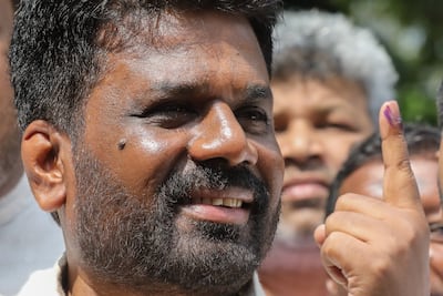 Sri Lankan President Anura Kumara Dissanayake shows his ink-marked finger after casting his vote. EPA