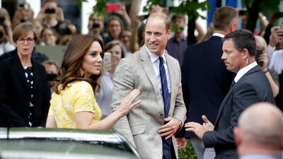 Britain's Prince William, centre right, and his wife Kate, the Duchess of Cambridge, centre left, arrive at the German Cancer Research Centre in Heidelberg, Germany. Matthias Schrader / AP Photo