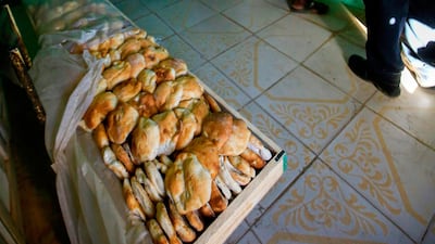 Sudanese people buy bread at a bakery in the town of Atbara, an industrial town 350 kilometres northeast of Sudan’s capital Khartoum. AFP