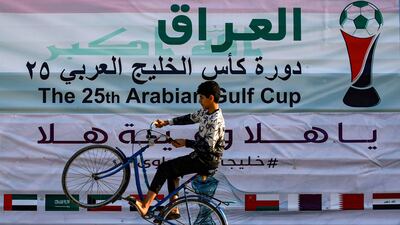 A wheelstand (or wheelie) stunt along the waterfront of the Shatt Al Arab waterway, at the conference of the Tigris and Euphrates rivers, in Iraq's southern city of Basra, on January 18, 2023. AFP