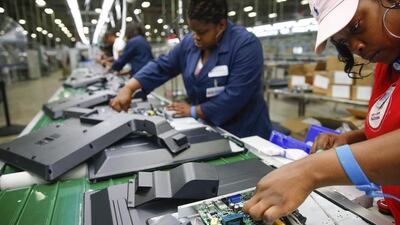 Workers on the assembly line work on installing the motherboard on the reverse side of a 32-inch TV at Element Electronics in Winnsboro, South Carolina. Element before had made all its TVs in Asia - but it was unable to get them on Walmart's shelves because there was nothing that differentiated them from rivals' products. Today, Element's 32- and 40-inch TVs that are now available in all of Walmart’s more than 4,000 US stores. Chris Keane / Reuters