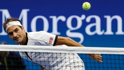 Roger Federer eyes the ball as it passes the net. Reuters