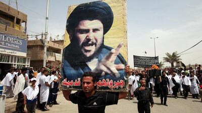 Followers of radical Shia cleric Muqtada Al Sadr march in the Sadr City neighborhood of Baghdad (AP Photo/Karim Kadim)