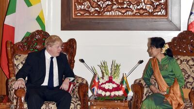 In this image provided by Ministry of Information, Britain's Foreign Secretary Boris Johnson, left, speaks with Myanmar's Foreign Minster Aung San Suu Kyi during their meeting at Foreign Ministry Office in February in Naypyitaw, Myanmar. Ministry of Information via AP