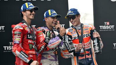 Martin, centre, with the second and third runners-up, Francesco Bagnaia of Italy, left, and Marc Marquez of Spain. Getty Images