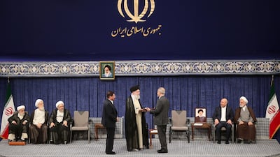 Iranian supreme leader Ayatollah Ali Khamenei delivers an official endorsment letter to president elect Masoud Pezeshikan. EPA