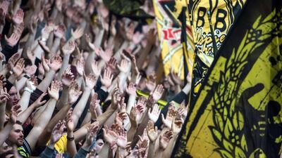 Dortmund's supporters cheer their team during their Bundesliga match against Hertha Berlin last Saturday. Bernd Thissen / AFP / DPA / May 9, 2015
