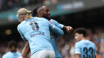 Manchester City's Antoine Semenyo celebrates with Erling Haaland after scoring the third goal in the FA Cup quarter-final at the Etihad Stadium. AFP