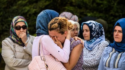 Relatives of a victim of the Ataturk airport attack mourn in Istanbul during his funeral. Ozan Kose / AFP