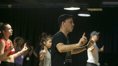 Jason Ramsburg, director of live entertainment for Dubai Parks and Resorts, trains aspirants for a dance show. Mona Al Marzooqi / The National