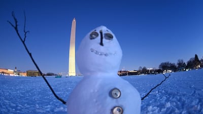 A snowman sits in front of the Washington Monument. AFP