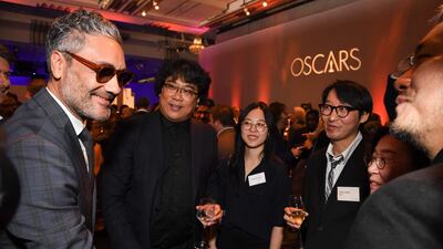 Director Taika Waititi meets fellow director Bong Joon-ho and his team during the 2020 Oscars Nominees Luncheon. AFP